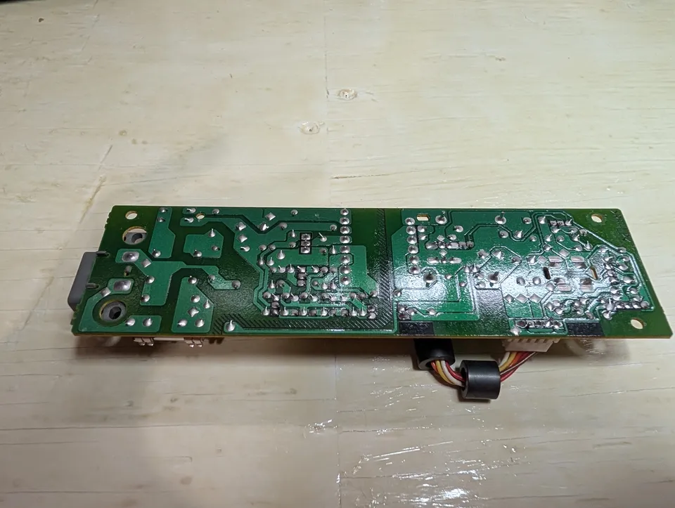 The power supply board, out of the shell. Dusty, nothing more.