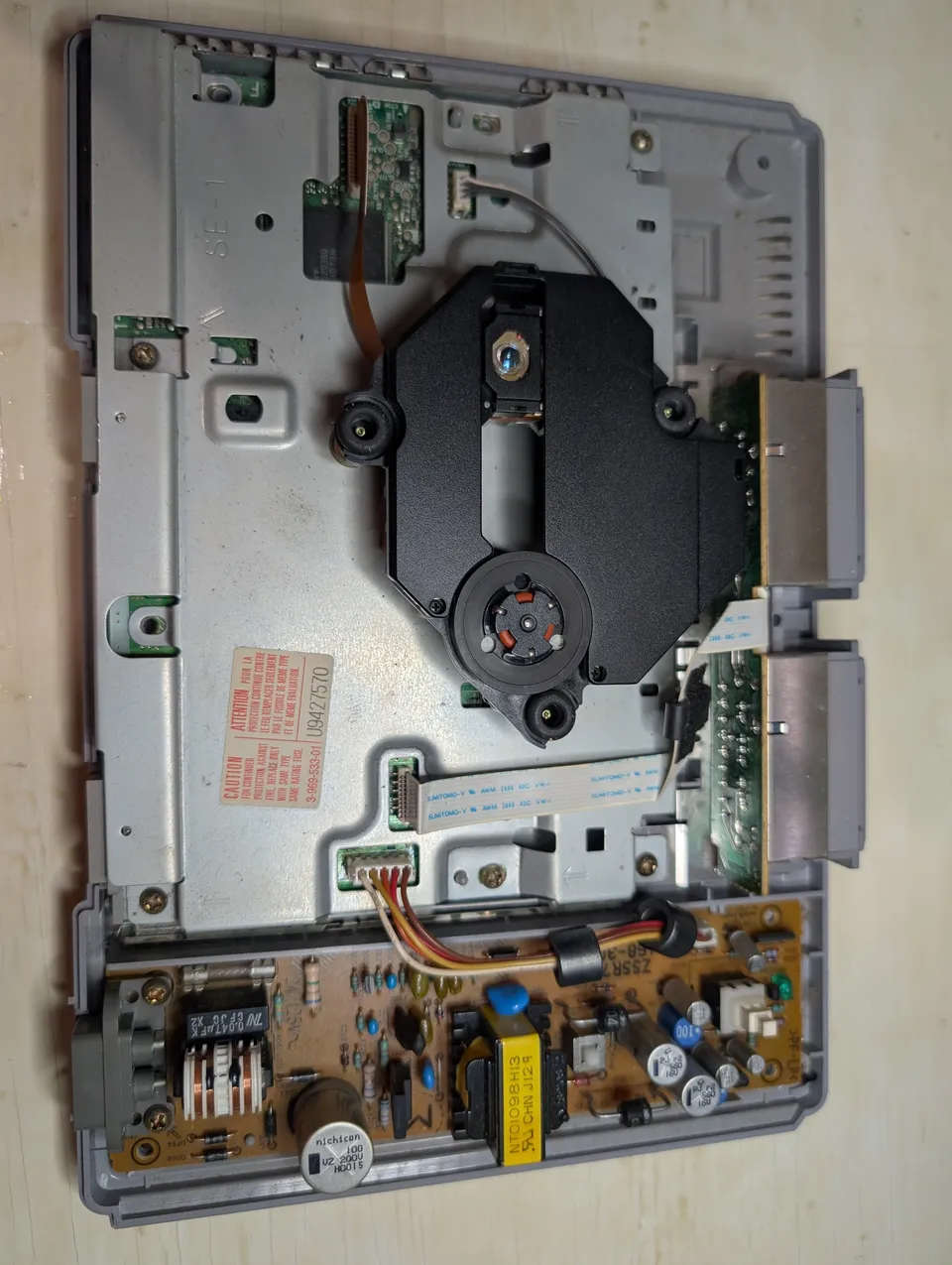 Lid off. Dust on everything, damage on nothing.