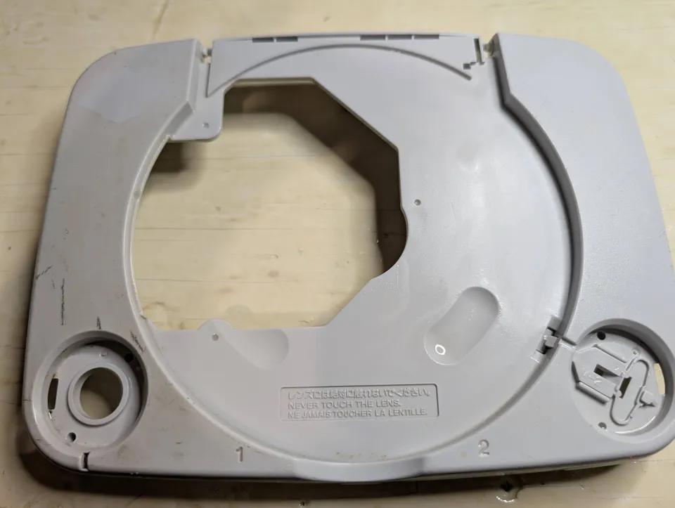The inside of the top shell, halfway through. The right side has been scrubbed, the left hasn't.