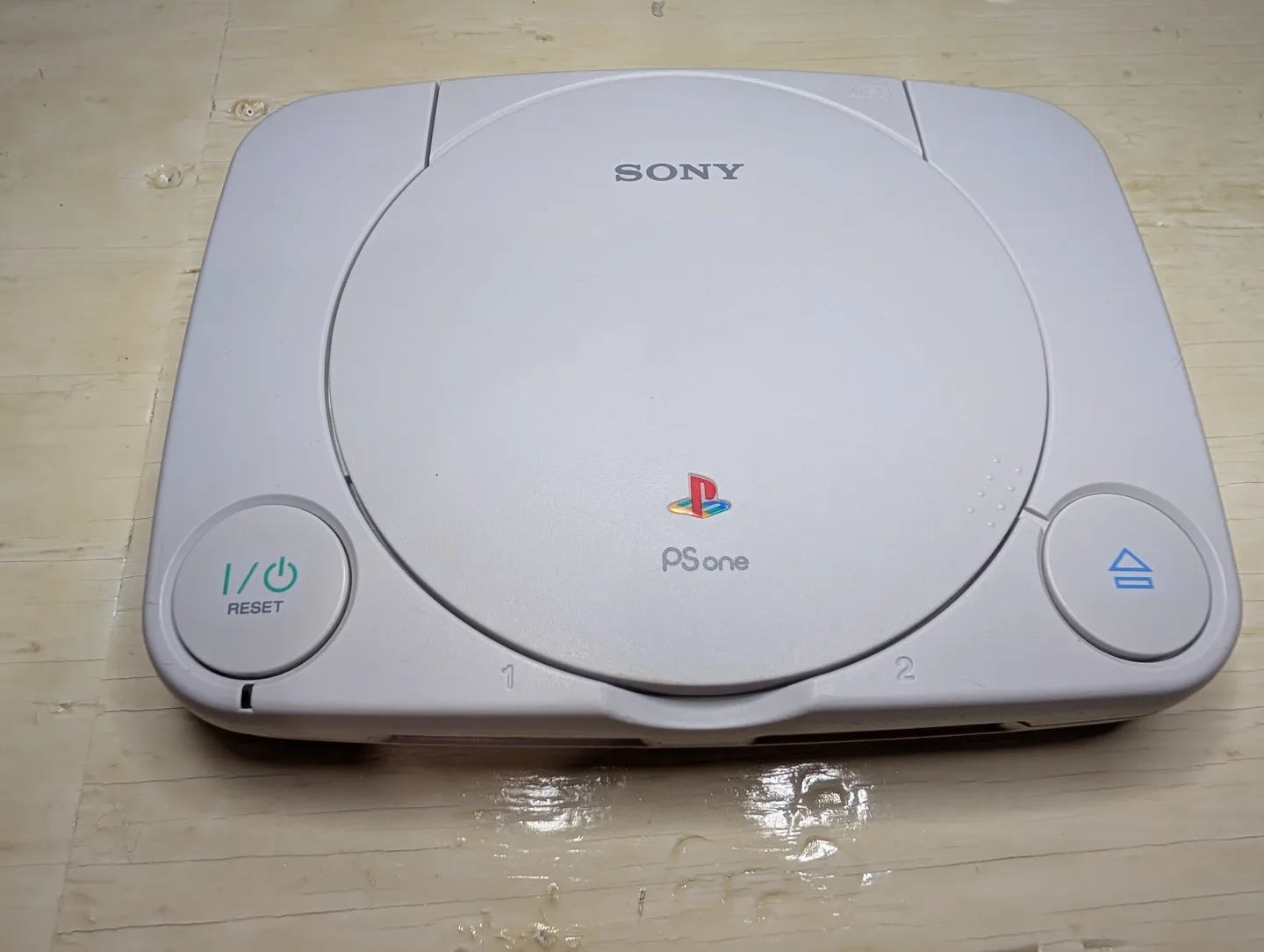 After: Somebody chipped this PSone with hot glue